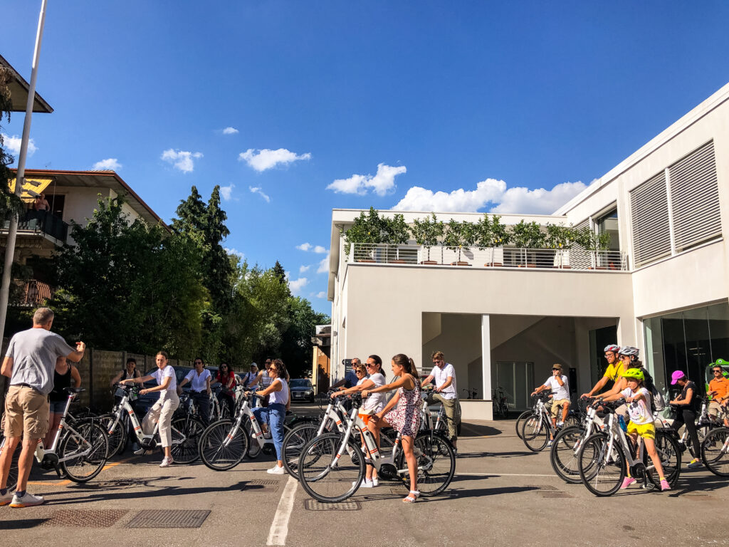 Cycling group departing from Girolibero headquarters in Vicenza.