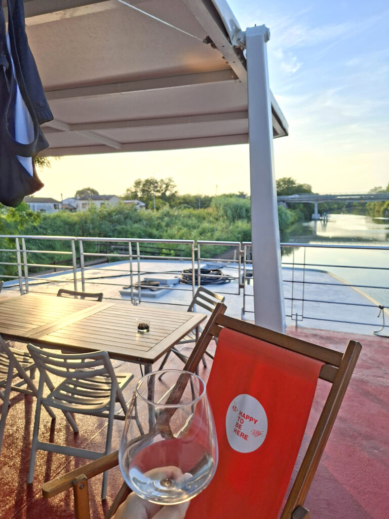 Sunset aperitif on the sun deck of the Girolibero barge along the Po Valley